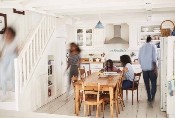 Interior Of Busy Family Home With Blurred Figures